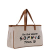 a white bag with a brown handle and the words the one where sophiie