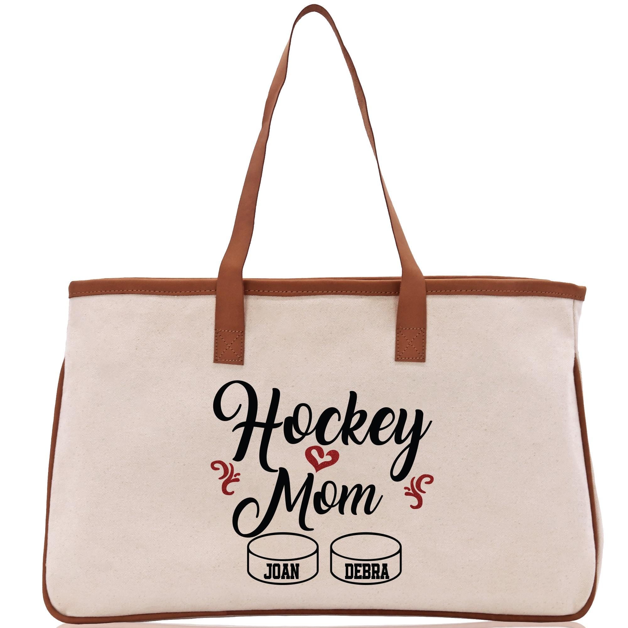 a tote bag with hockey mom written on it