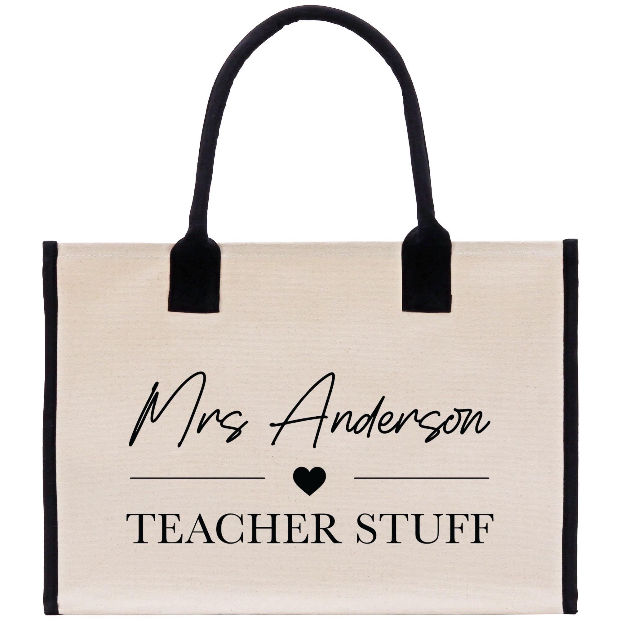 a white bag with a black handle that says, mrs anderson teacher stuff