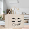 a shopping bag with a face drawn on it