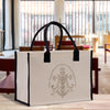 A large white tote bag with a black handle and straps, featuring a decorative emblem on the front.