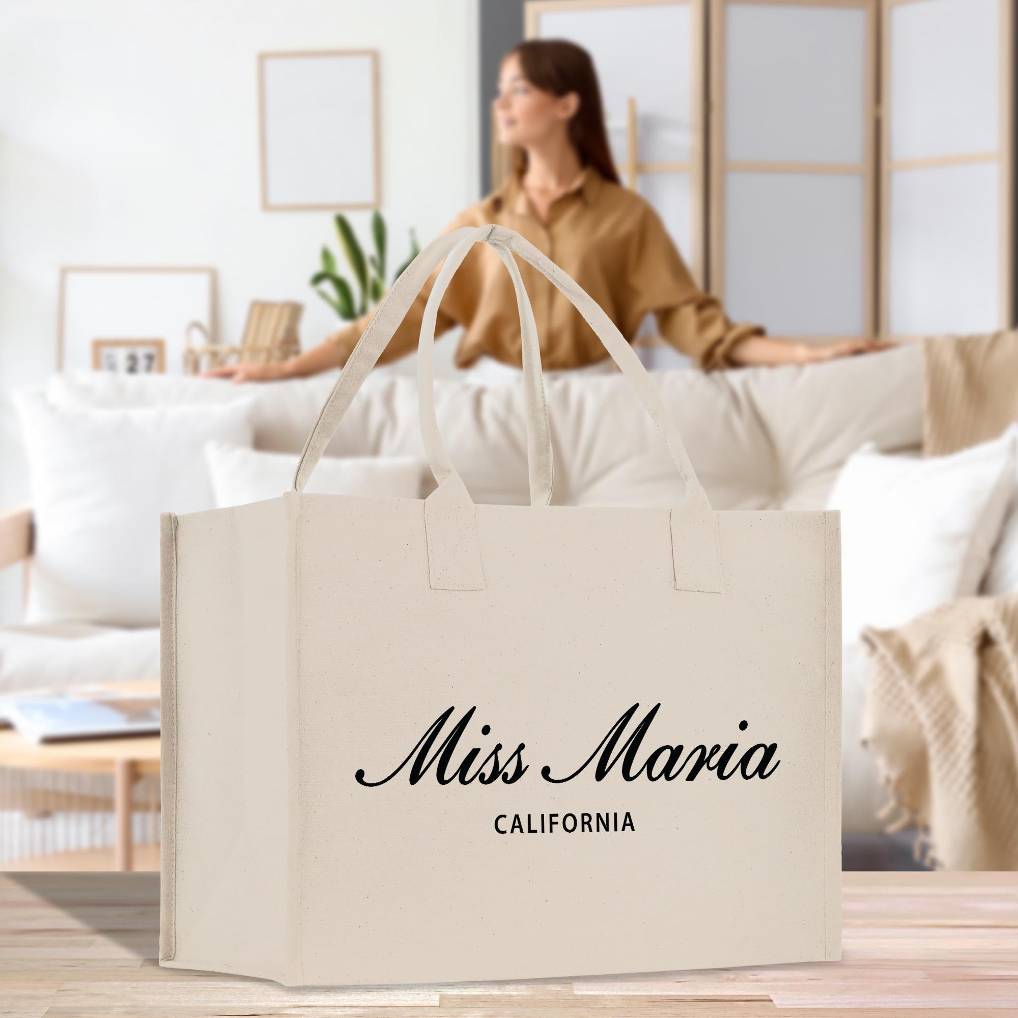 a woman sitting on a couch with a bag in front of her