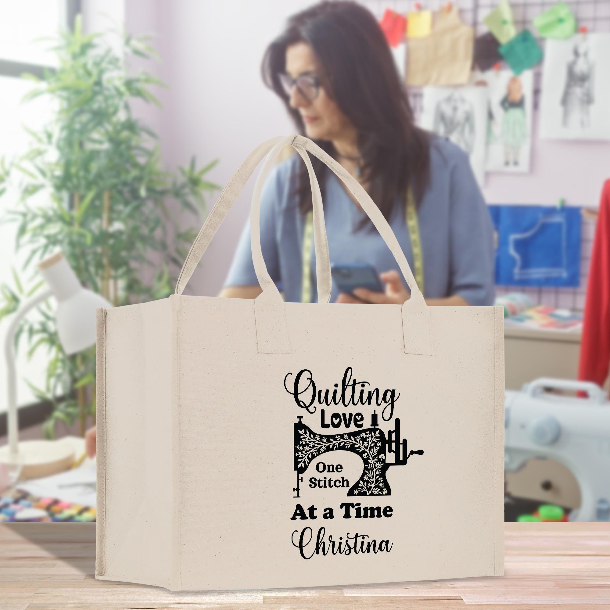 a woman looking at her cell phone while holding a shopping bag