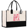 a black and white bag with a pink print on it
