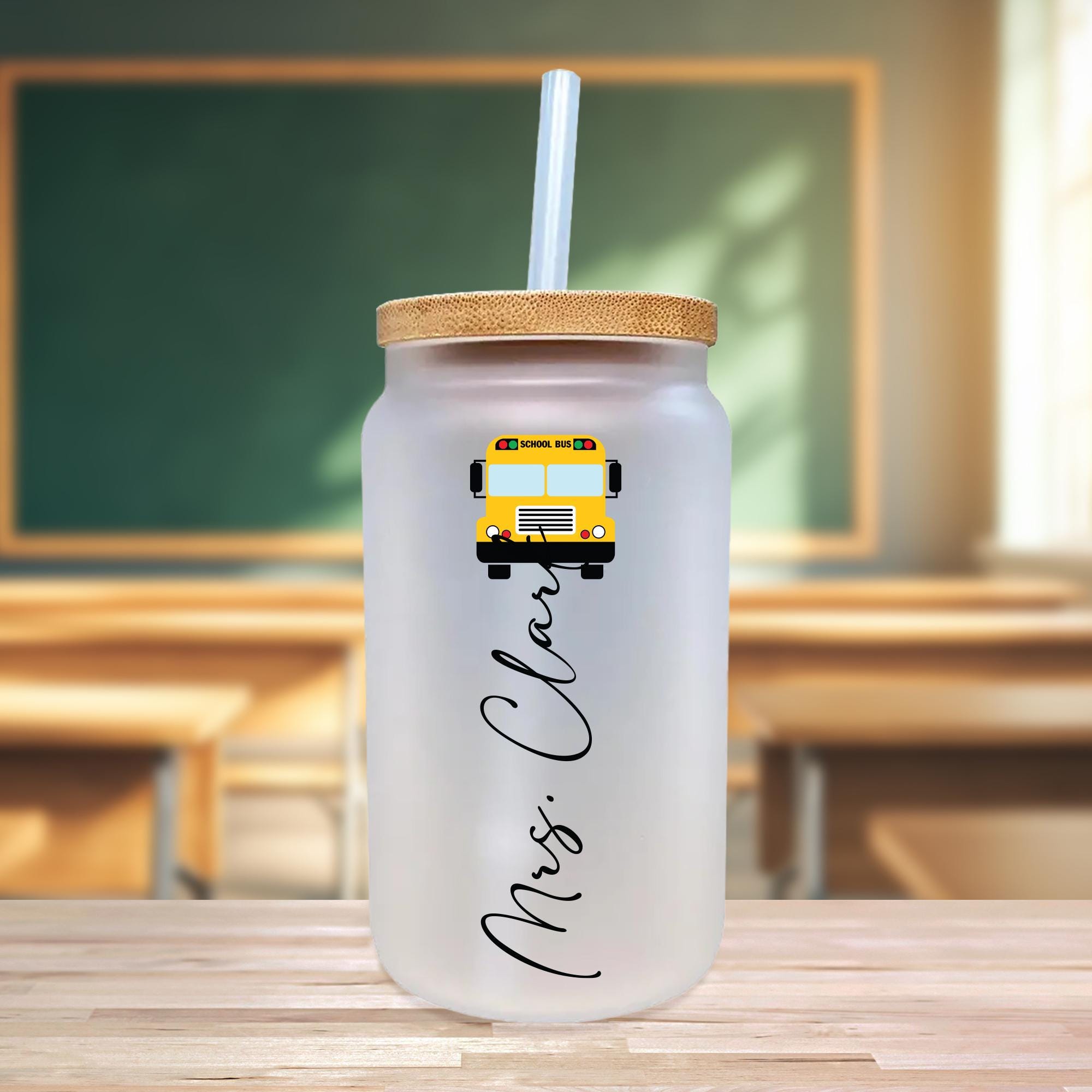 a white glass with a yellow school bus on it