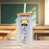 a white glass with a yellow school bus on it