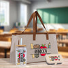 a tote bag with a drink next to it