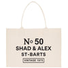 A beige tote bag with black text and graphics printed on it.