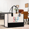 a black and white bag sitting on top of a wooden table
