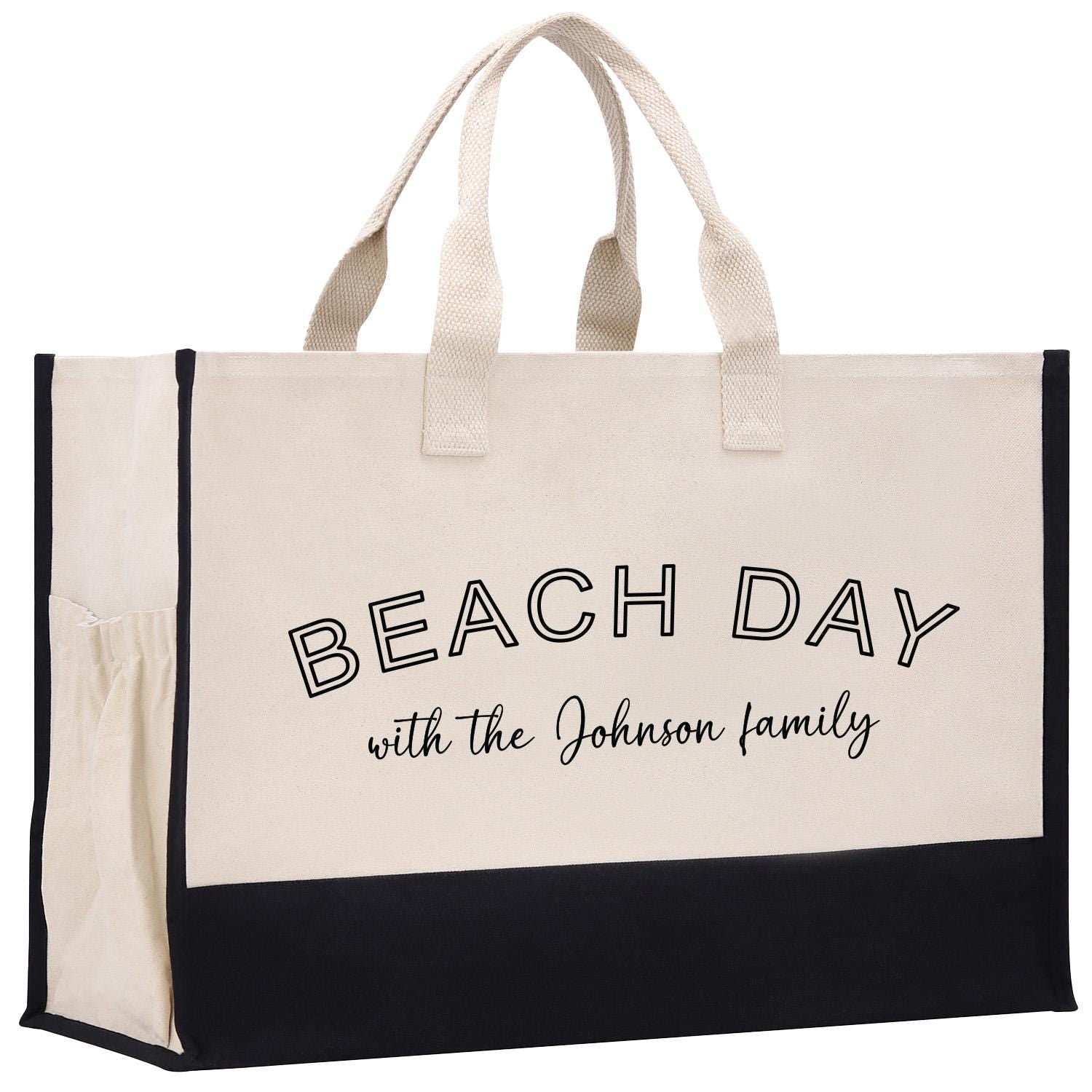 a black and white beach bag with the words beach day with the johnson family