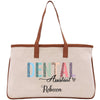 a white canvas bag with a brown leather handle
