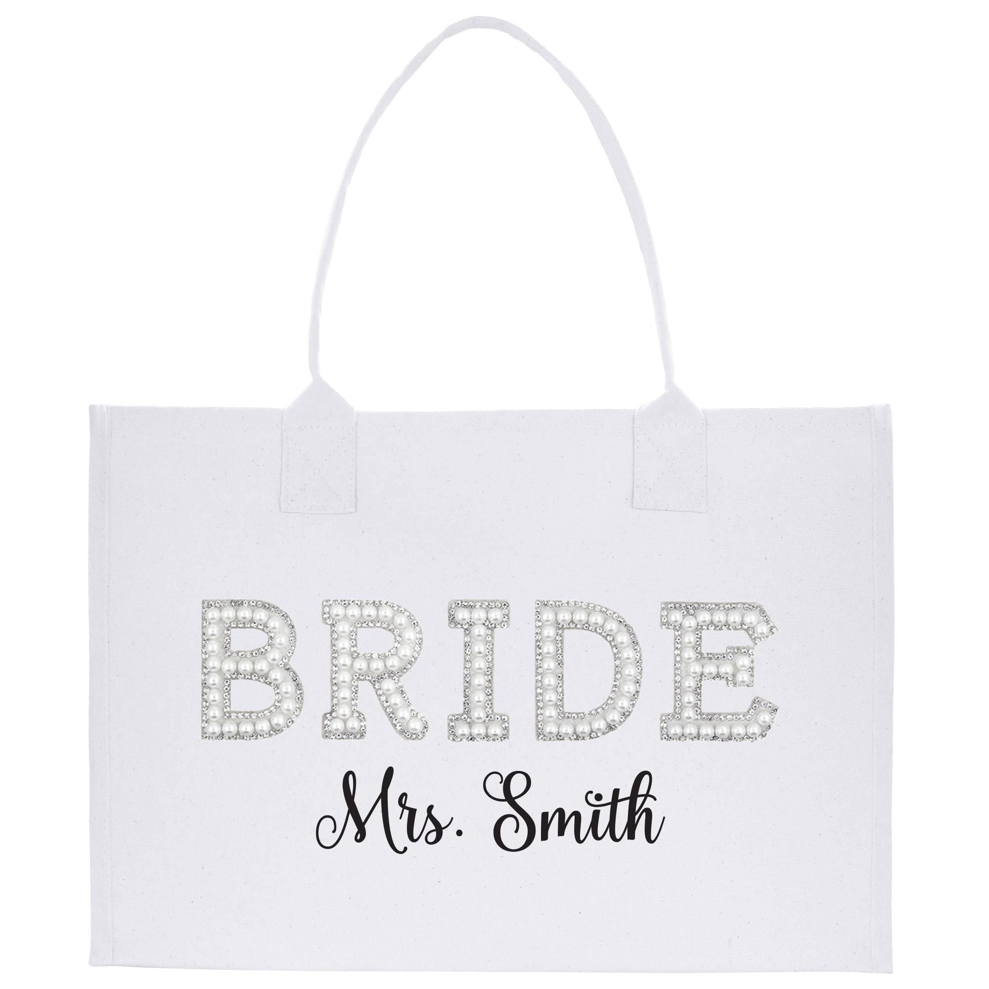 A white tote bag with the word &quot;BRIDE&quot; and the name &quot;Mrs. Smith&quot; printed on it.
