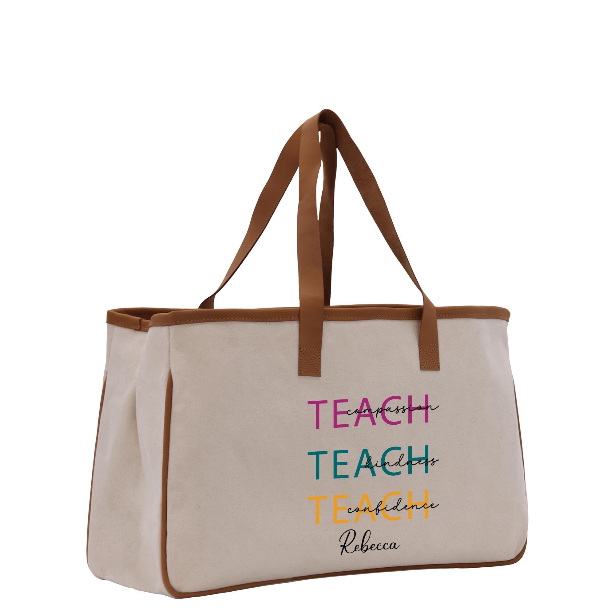 a white canvas bag with a teacher written on it