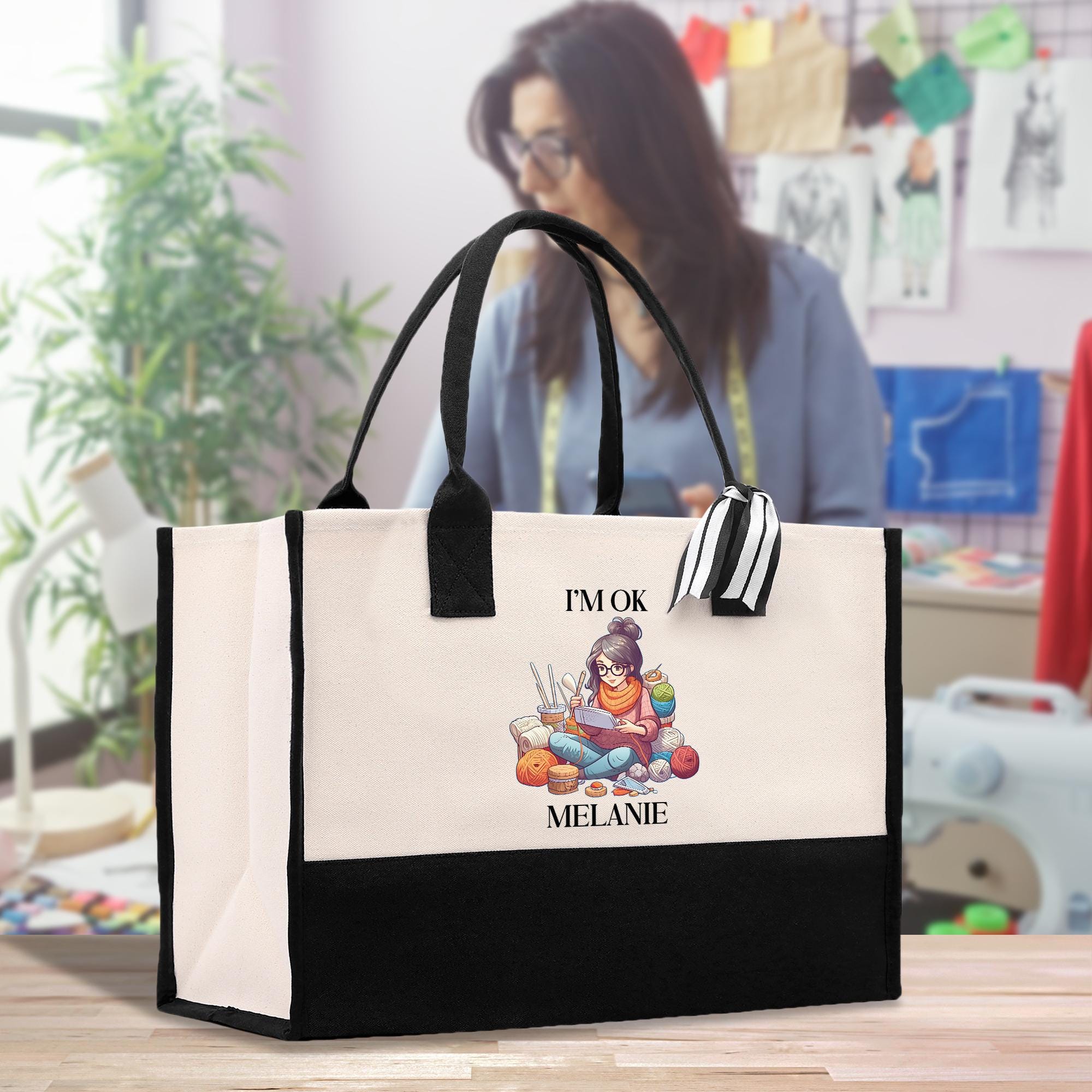 a woman holding a black and white shopping bag