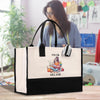 a woman holding a black and white shopping bag