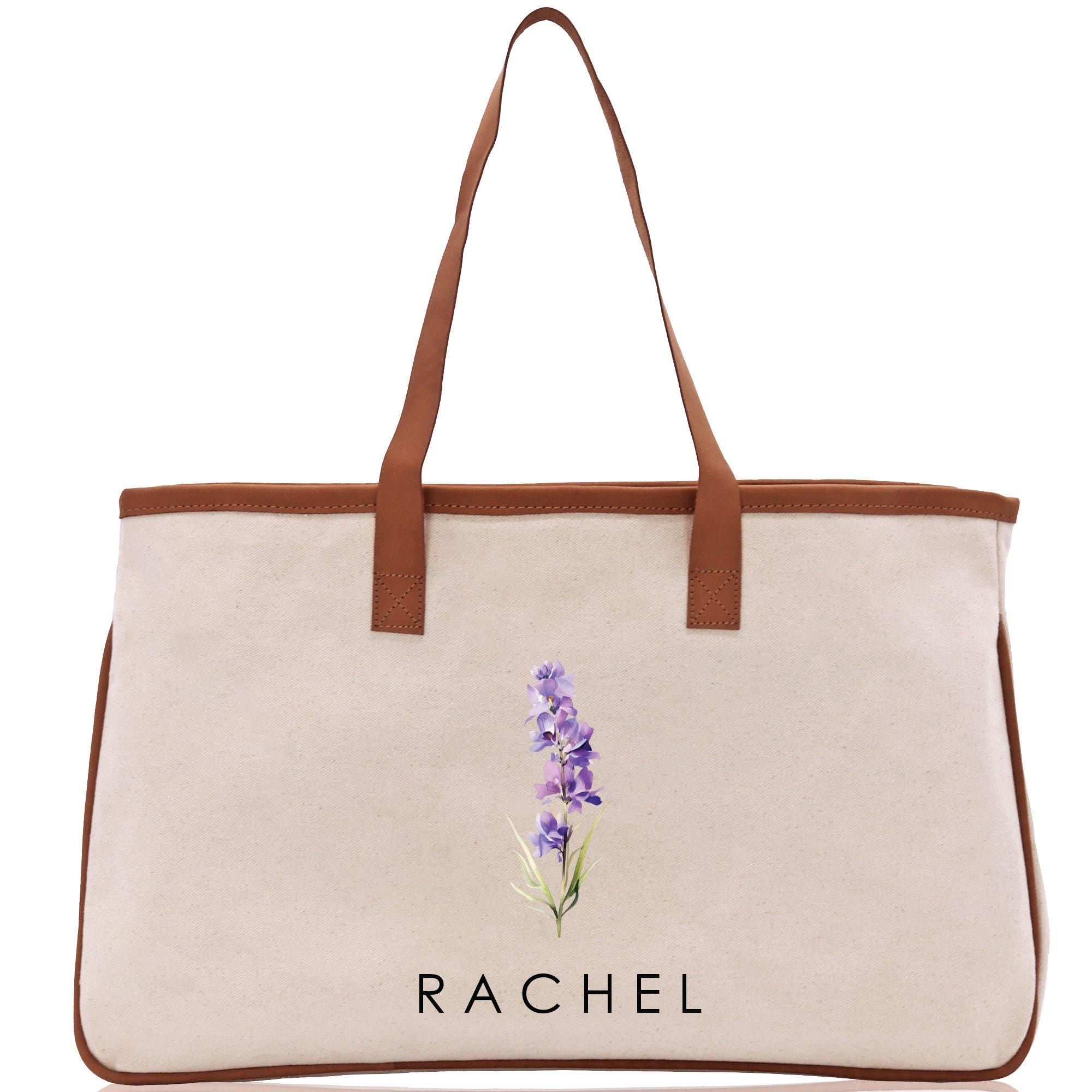 a white bag with a purple flower on it