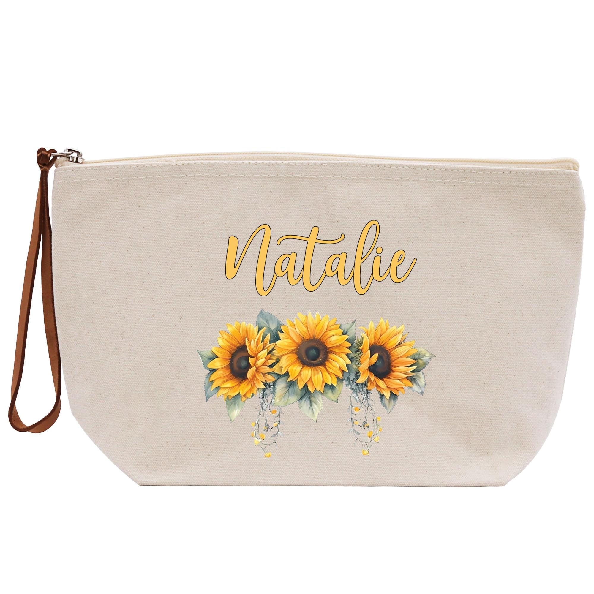 a white bag with sunflowers on it