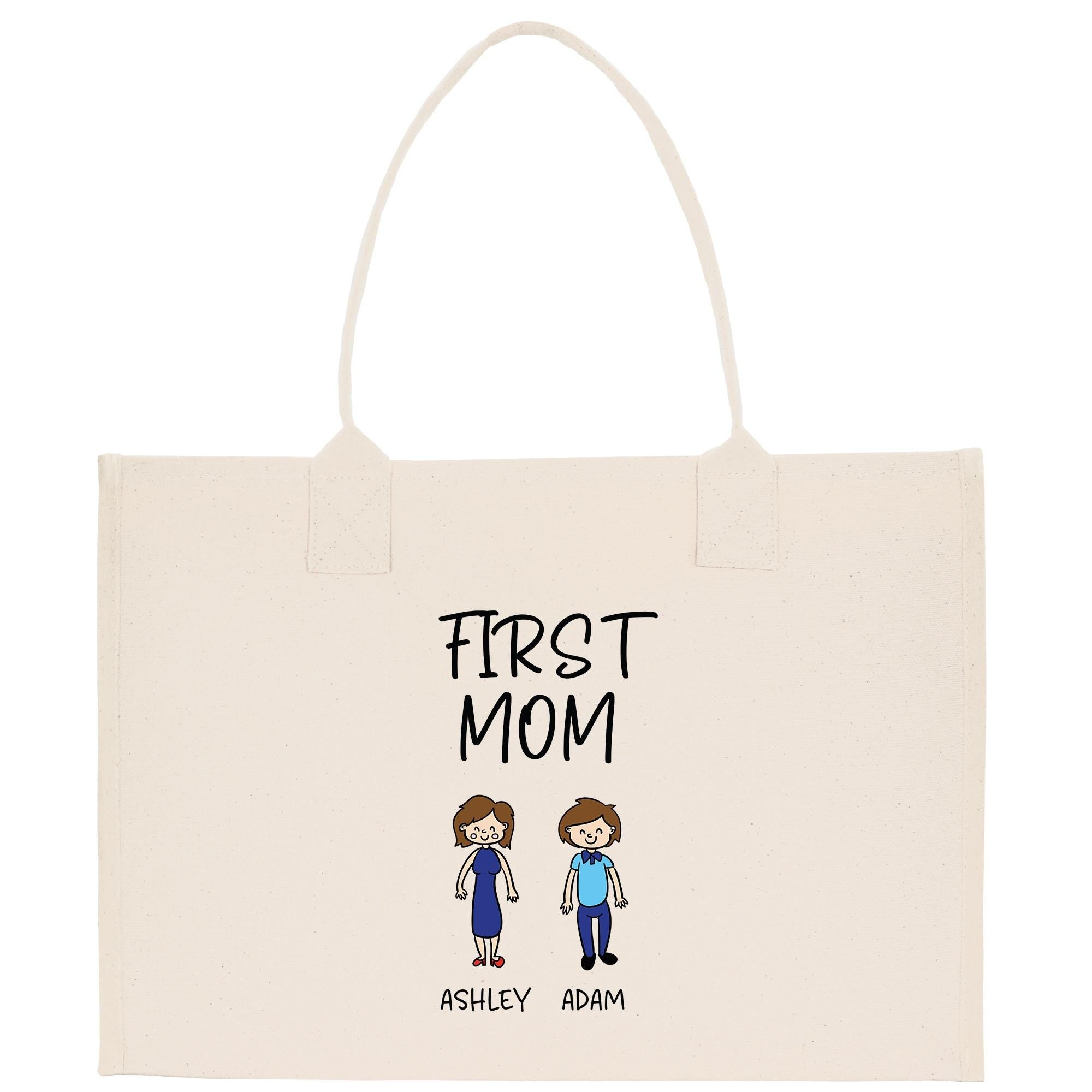 A beige canvas tote bag with a printed design featuring two cartoon-style figures, one male and one female, along with the text &quot;FIRST MOM&quot; and the names &quot;ASHLEY ADAM&quot;.