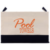 A beige and black bag with the text "Pool Towels" printed in orange on it.