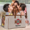 a woman kissing a little girl while sitting in front of a bag