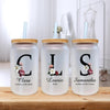 three personalized water bottles sitting on a table