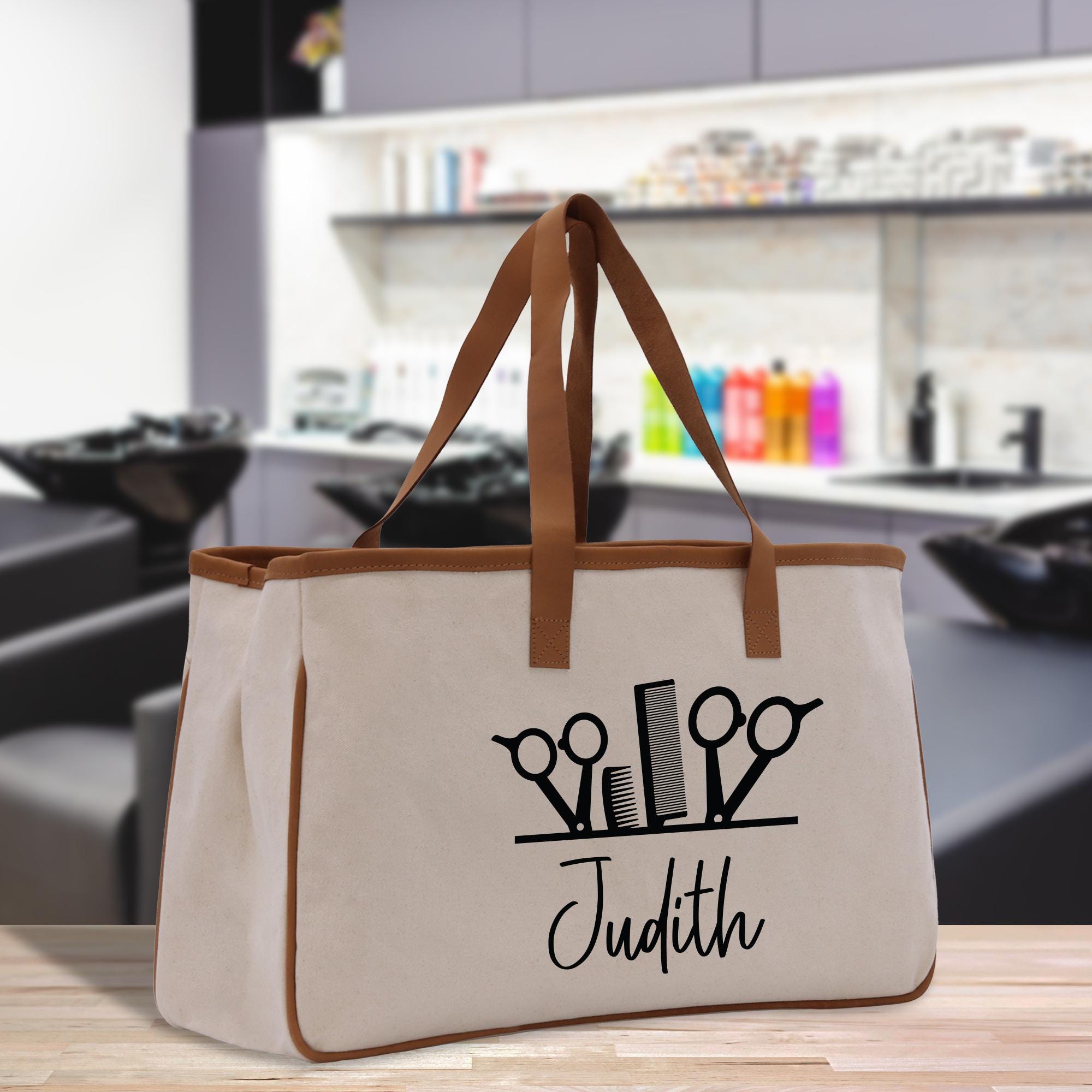 a tote bag with scissors and a name on it