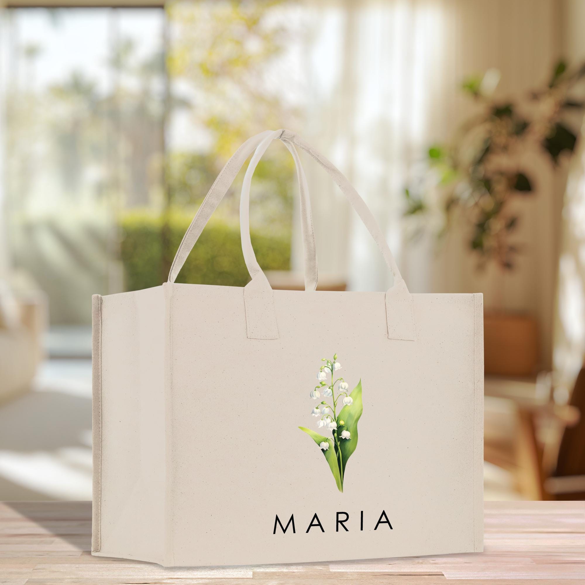 a white shopping bag with a flower on it