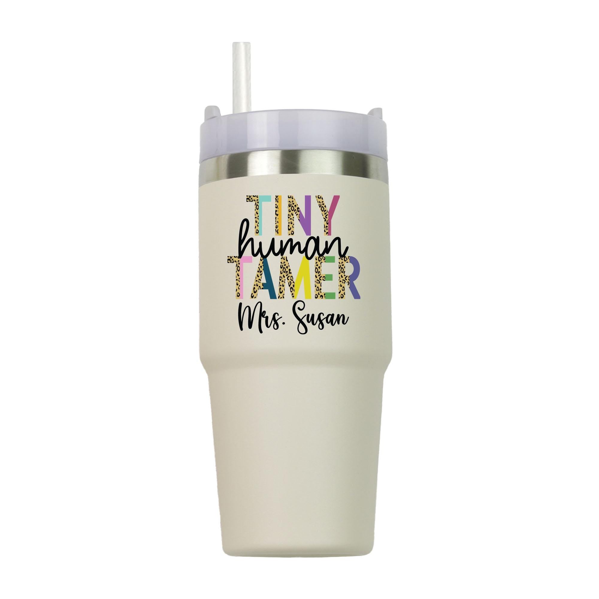 a tumbler cup with a straw sticking out of it