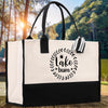 A black and white tote bag with the text 