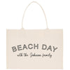 a white beach bag with the words beach day with the johnson family