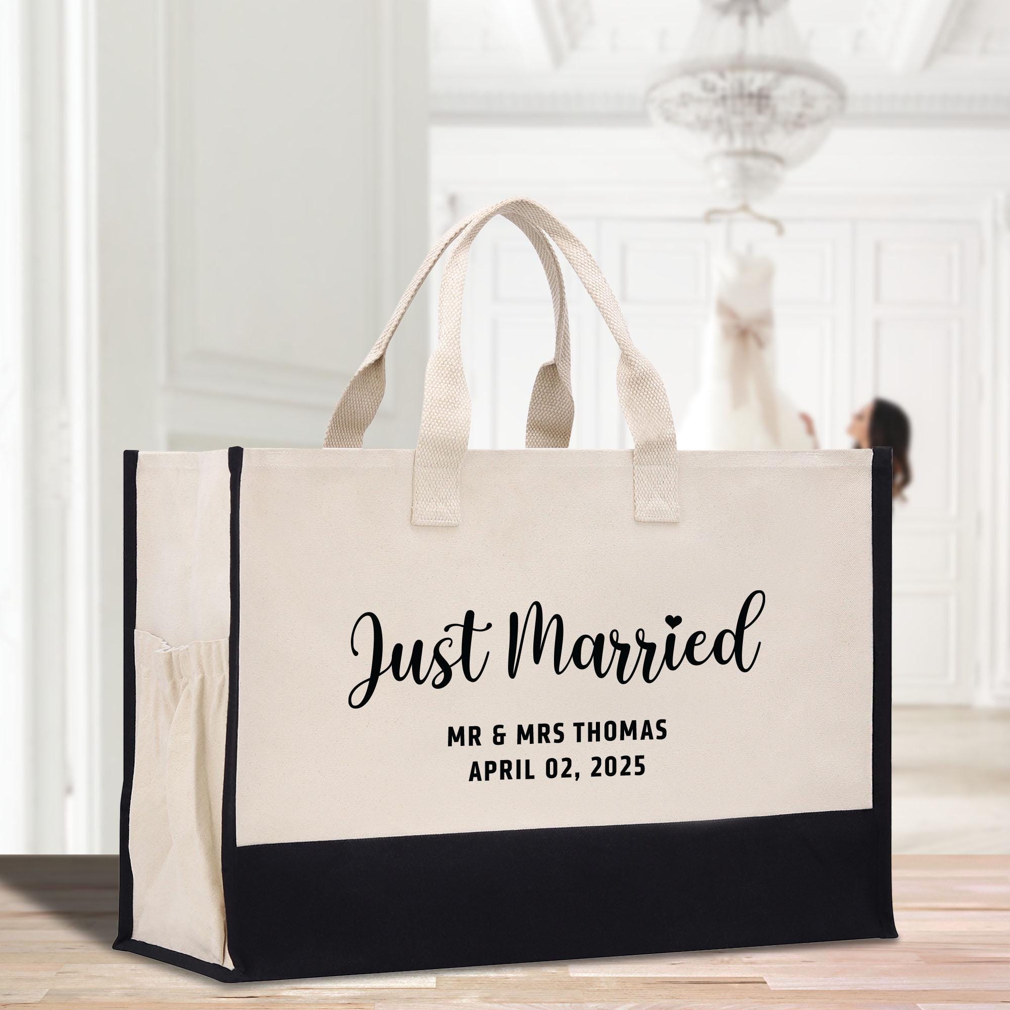 a tote bag with a bride and groom&#39;s names on it