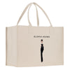 a white shopping bag with a picture of a woman in a tuxedo