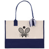 A navy blue and cream tote bag with a tennis racket and ball graphic printed on it, along with the text "#MESSY" printed below.