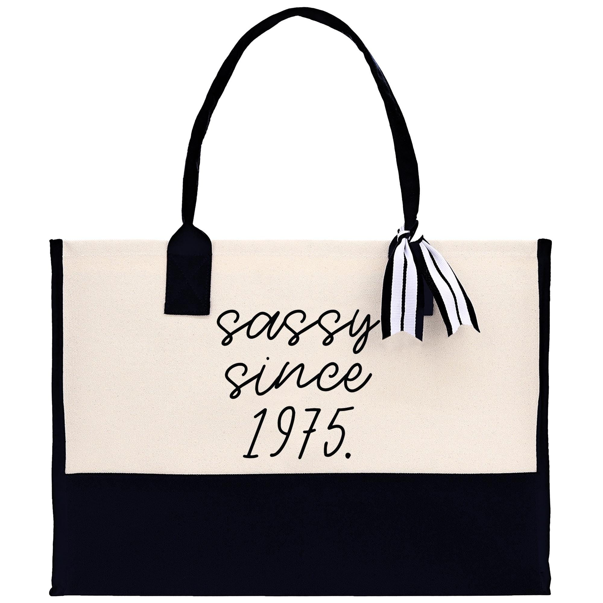 a black and white handbag with the words sassy since 1915 printed on it