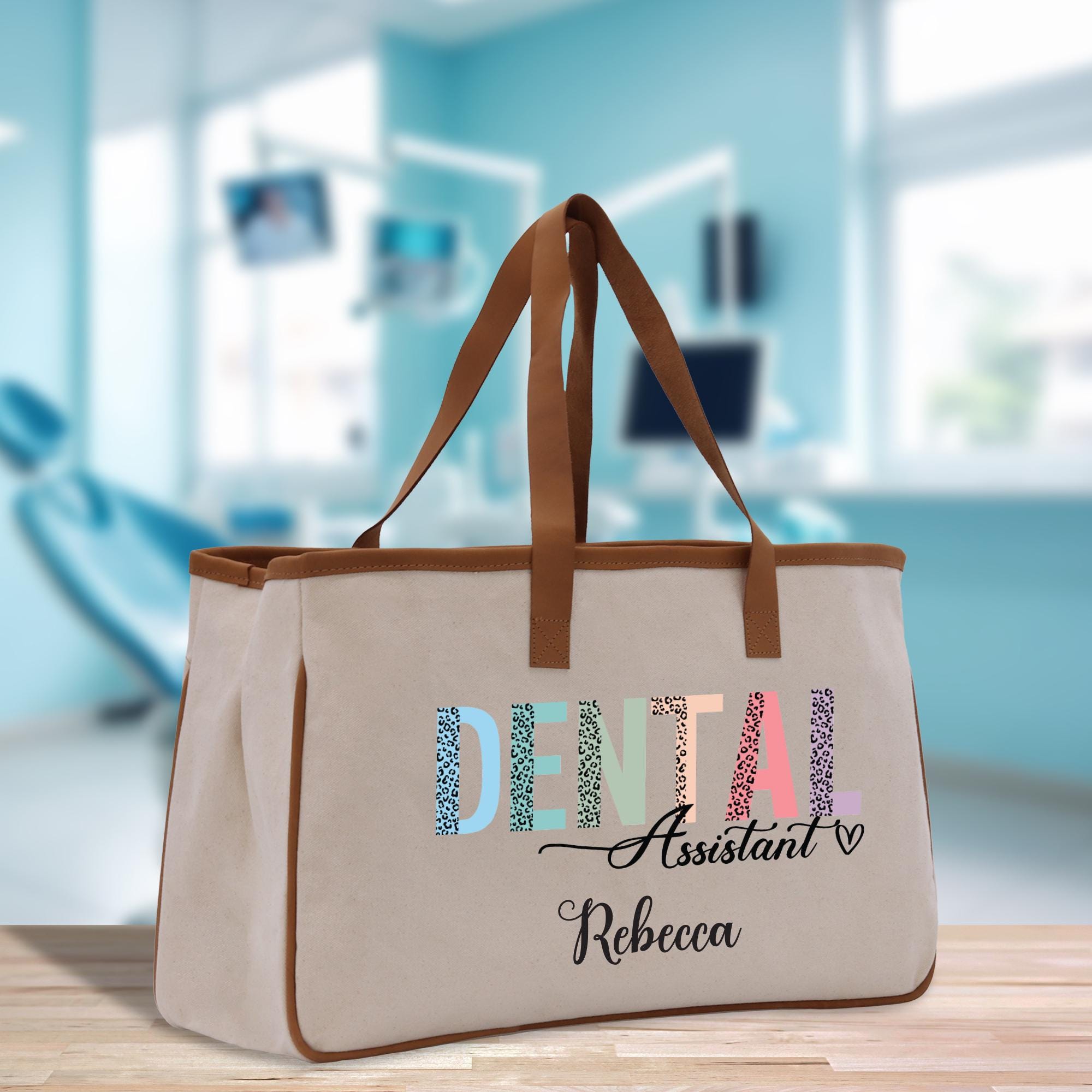 a canvas tote bag with the words dental assistant and ribecca on it