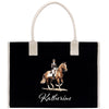 A black tote bag with a white handle and a printed image of a person riding a horse on it.