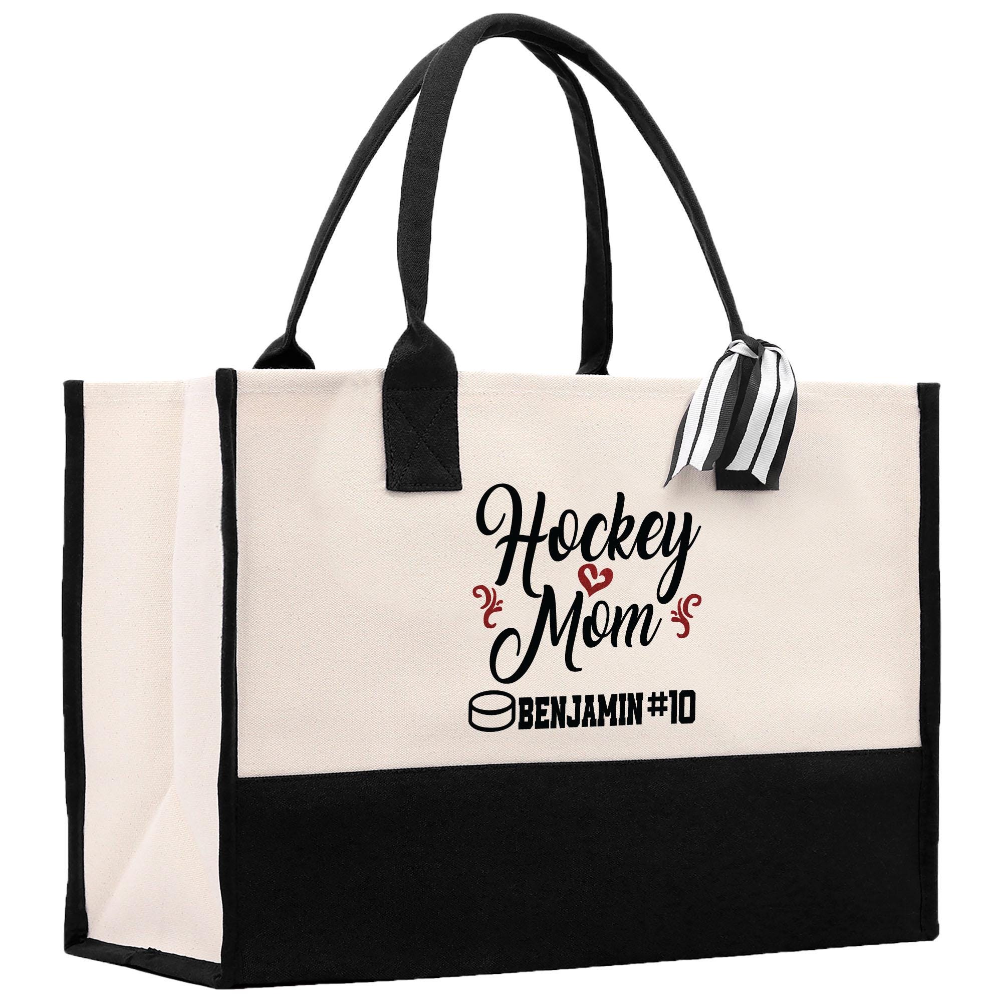 a black and white tote bag with hockey mom on it