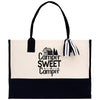 A black and white tote bag with the text 