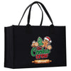 A black tote bag with a colorful graphic design featuring a gingerbread man and the text "The Cookie Crew" printed on it.