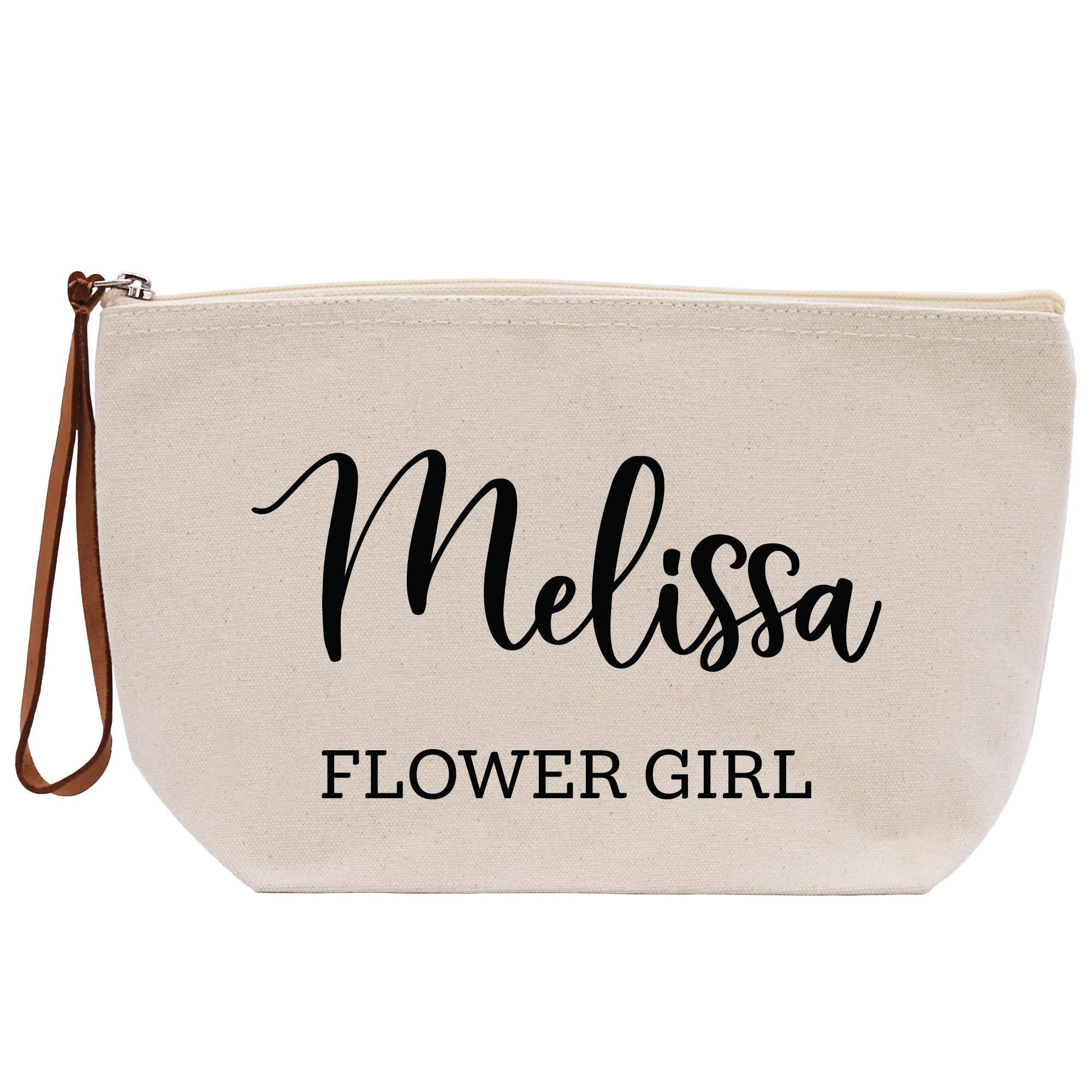 a white zippered bag with a name on it