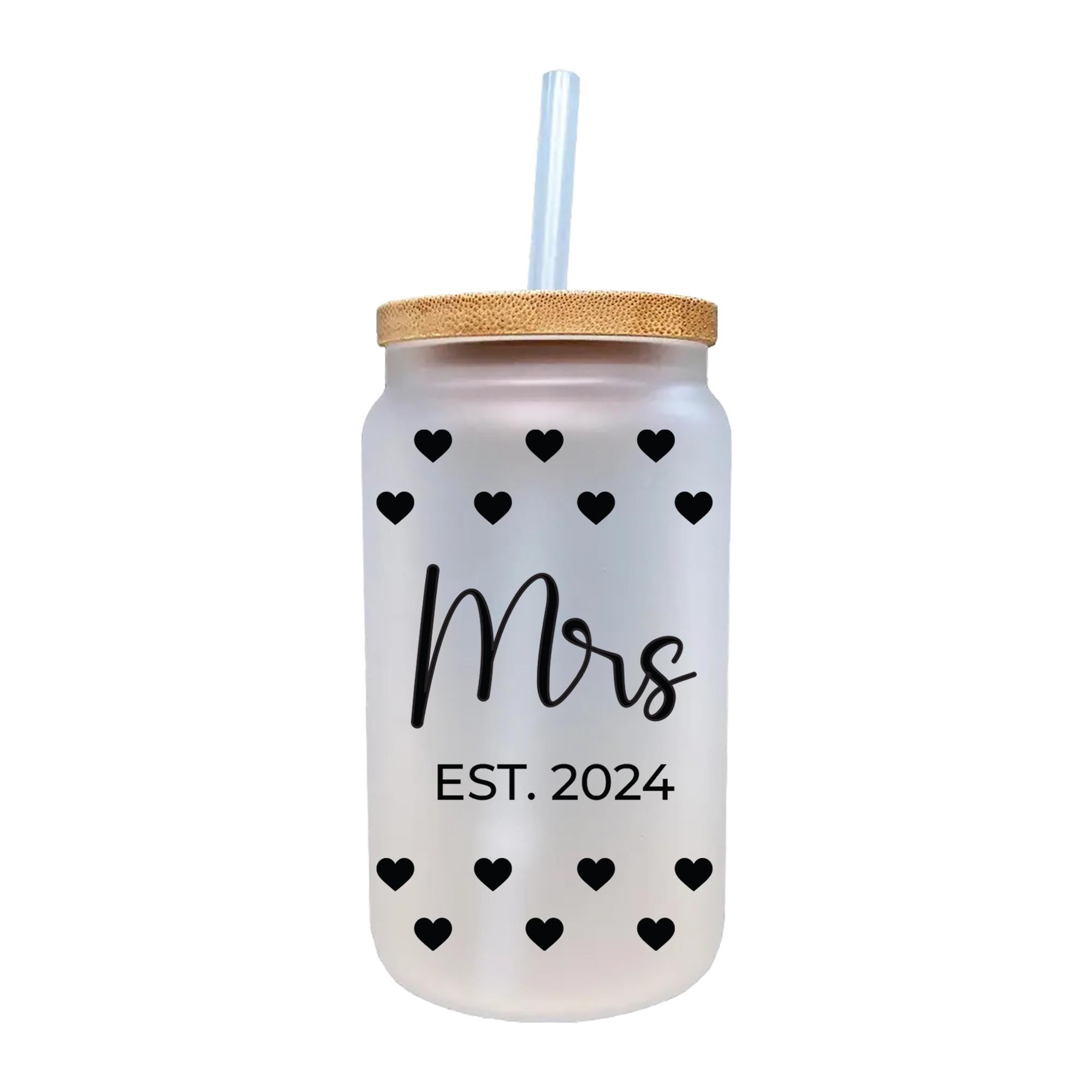 a white mason jar with black hearts on it