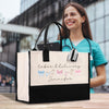a woman holding a shopping bag with a name on it