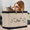 a woman is holding a bag with a cat in it