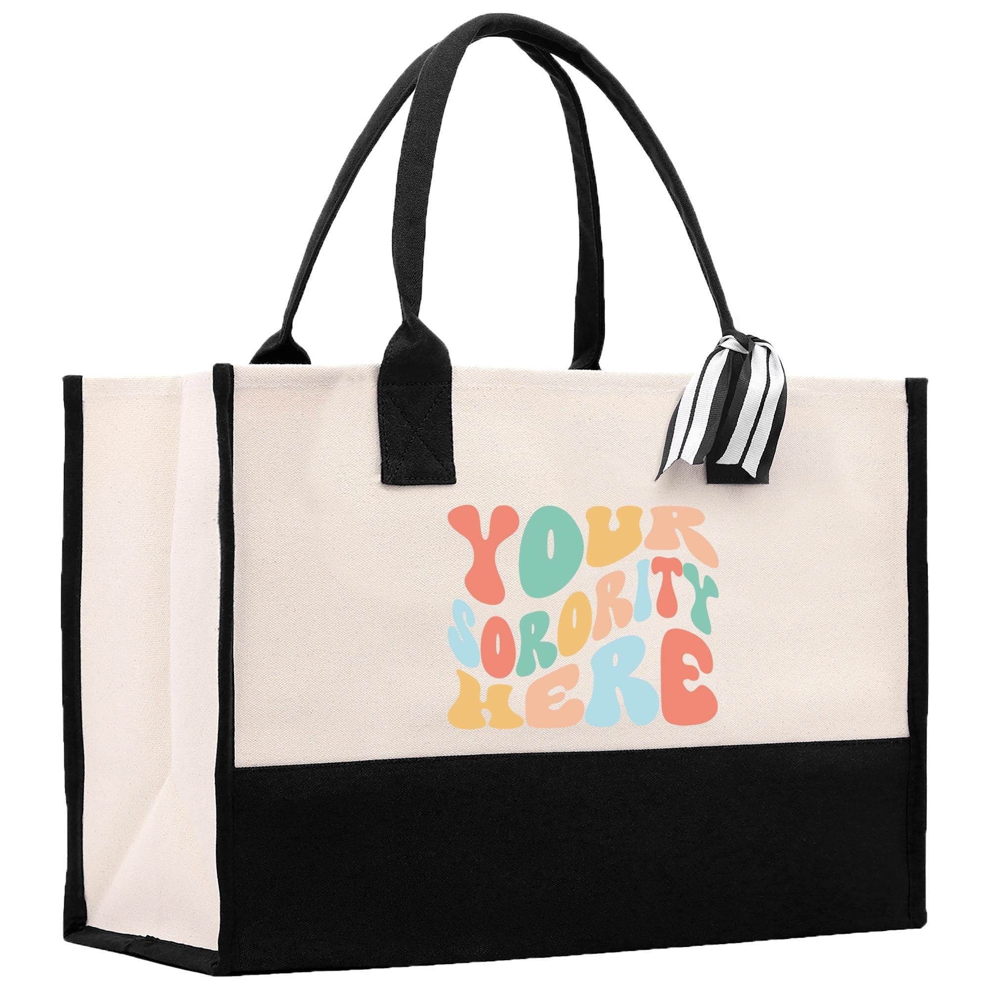 a white and black bag with a black handle