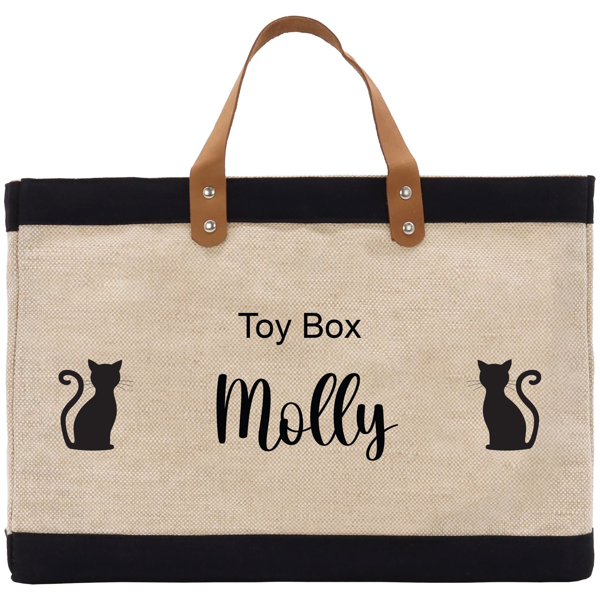 a canvas tote bag with a black cat on it