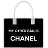 a black and white bag with the words, my other bag is chanel