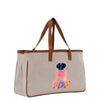 A beige canvas tote bag with a printed image of a perfume bottle and flowers on it.
