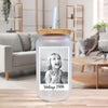a glass jar with a picture of a child on it