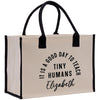 a white bag with black handles that says it's a good day to teach