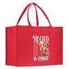 a red bag with a picture of flowers on it